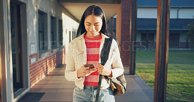 Buy stock photo Phone, happy and student at school for education with networking, texting and contact on mobile app. Smile, technology and girl teenager with cellphone for communication at academy for learning.