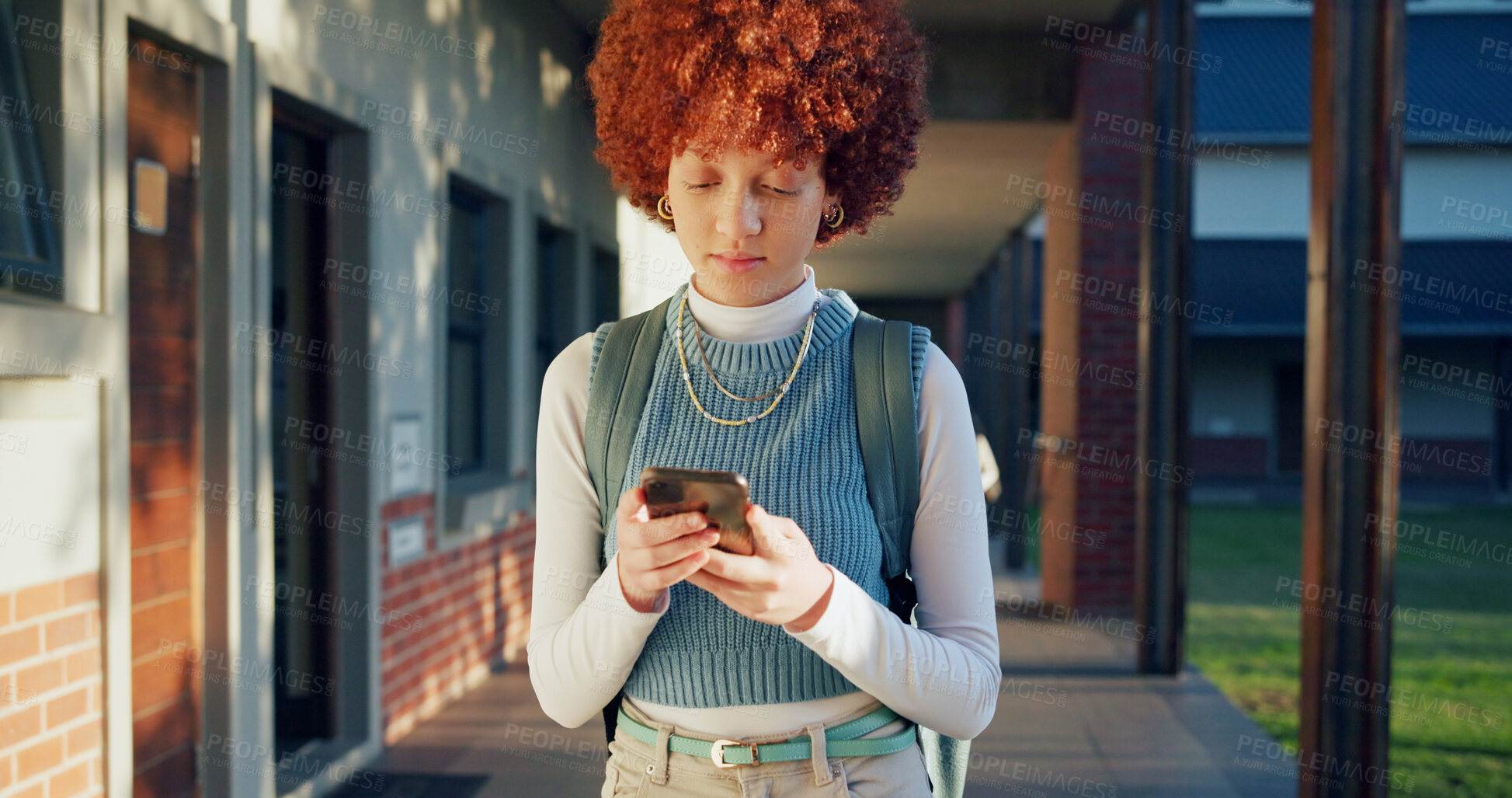 Buy stock photo Phone, typing and student at school for education with networking, texting and contact on mobile app. Reading, technology and girl teenager with cellphone for communication at academy for learning.