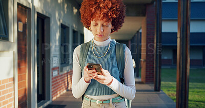 Buy stock photo Phone, typing and student at school for education with networking, texting and contact on mobile app. Reading, technology and girl teenager with cellphone for communication at academy for learning.