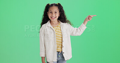 Buy stock photo Green screen, pointing and girl with smile for portrait, promotion and opportunity for advertising. Space, marketing and happy child with offer in studio, announcement and sale message notification