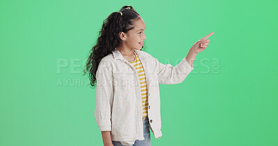 Buy stock photo Green screen, child and girl with smile for pointing, promotion and opportunity for advertising. Mockup space, marketing and happy kid with discount offer in studio, announcement and brand sale