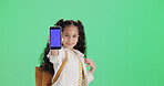 Green screen, phone and girl with smile for portrait, app promotion or advertising for digital education. Mockup space, student or child show mobile in studio, elearning site or platform announcement