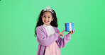Happy girl, portrait or pointing with gift box in studio for birthday present on a green background. Child, kid or model with tiara or wrapped prize for party offer, celebration or festivity on space
