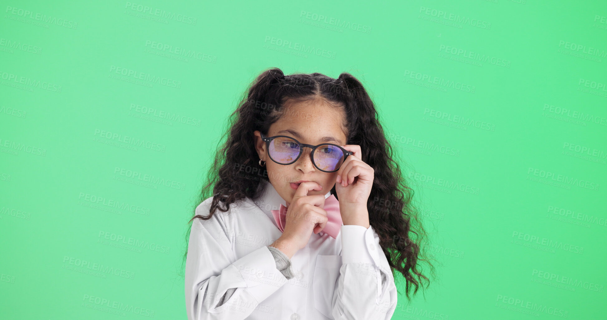 Buy stock photo Studio, think and business kid with glasses, mindset or problem solving with cosplay on space. Idea, eyewear and serious girl child with vision, professional insight or pretend on green background