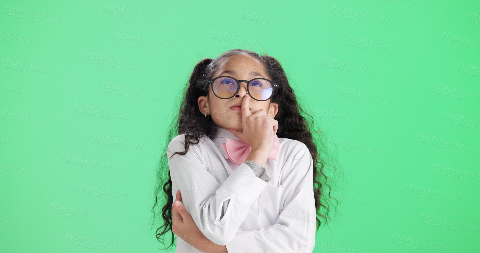 Buy stock photo Thinking, child and student with glasses in studio with vision, planning and ideas for education. Mockup space, kid and brainstorming with eyewear, question decision and knowledge on green background