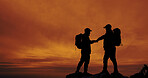 People, silhouette and fist bump for hiking, achievement and success outdoor on mountain with backpack. Hiker, sunset and teamwork or celebration in nature for fitness goals, exercise and space