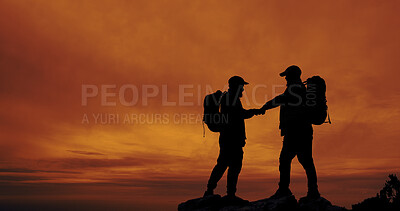 Buy stock photo People, silhouette and fist bump for hiking, achievement and success outdoor on mountain with backpack. Hiker, sunset and teamwork or celebration in nature for fitness goals, exercise and space