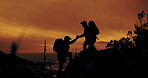 Climbing, help and hiking with silhouette of people outdoor in mountains at sunset for fitness or hobby. Health, teamwork and wellness with hiker friends in nature together for adventure and travel