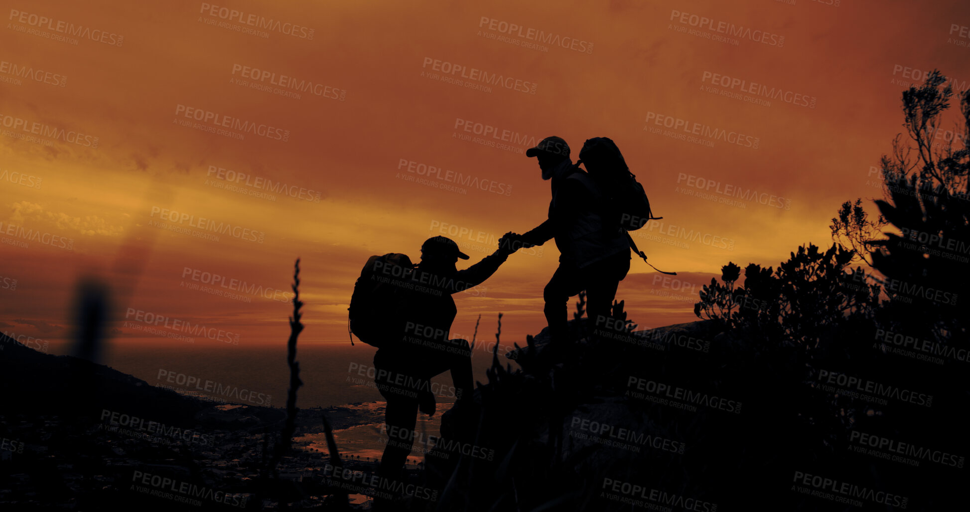Buy stock photo Climbing, help and hiking with silhouette of people outdoor in mountains at sunset for fitness or hobby. Health, teamwork and wellness with hiker friends in nature together for adventure and travel