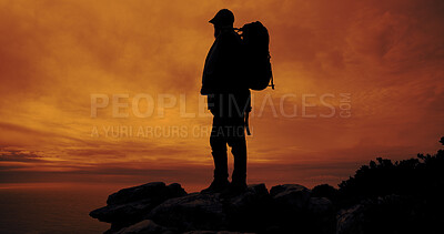 Buy stock photo Sunset, hiking and silhouette of man on mountain for adventure, reflection and view of ocean. Trekking, backpacking and person outdoor for holiday, travel and thinking with space for sightseeing