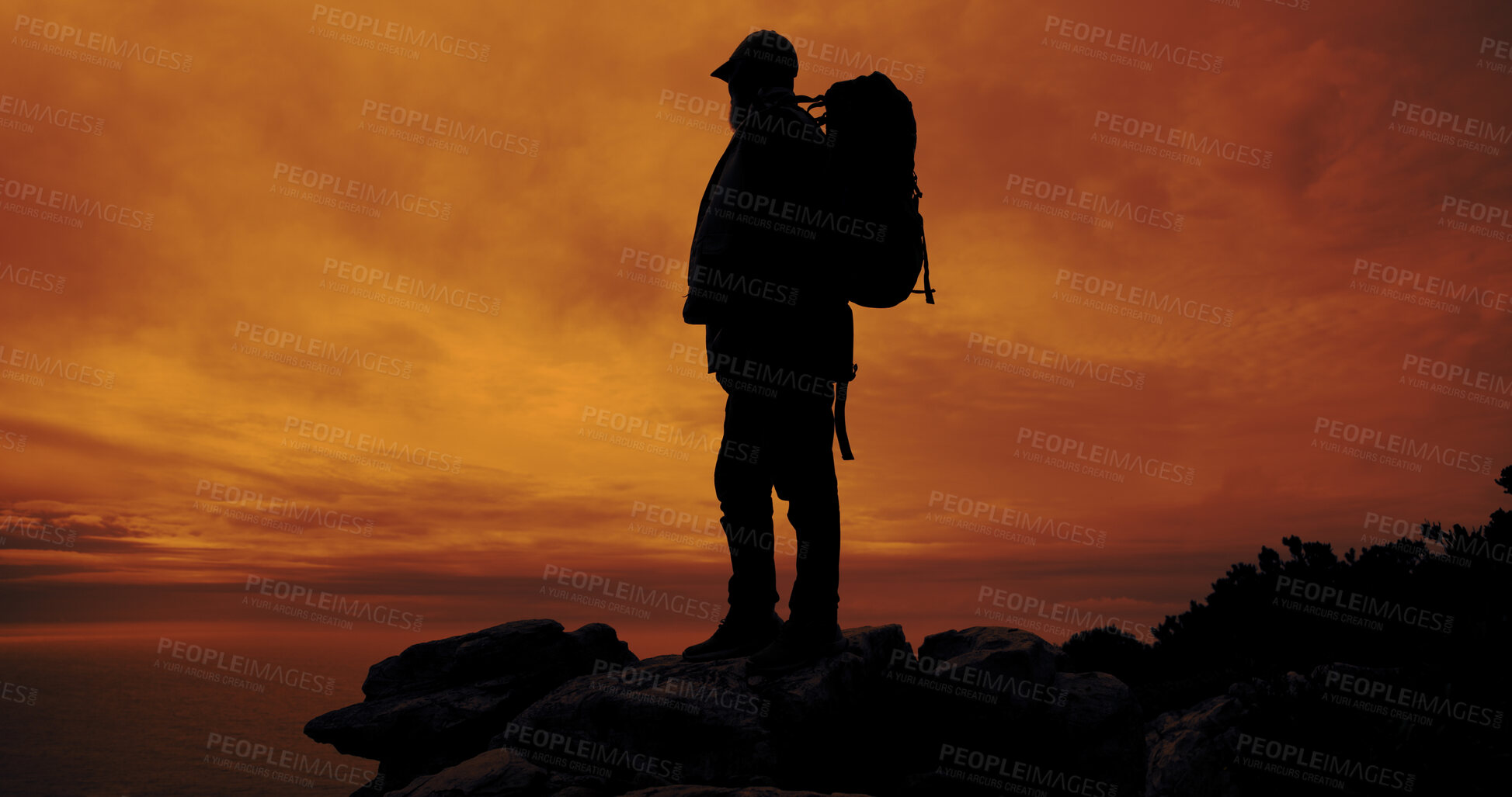 Buy stock photo Sunset, hiking and silhouette of man on mountain for adventure, reflection and view of ocean. Trekking, backpacking and person outdoor for holiday, travel and thinking with space for sightseeing