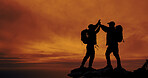 Sunset, silhouette and friends with high five for hike on mountain for vacation, adventure or holiday. Space, sky and shadow of men with celebration for backpacking goal on weekend trip for trekking.