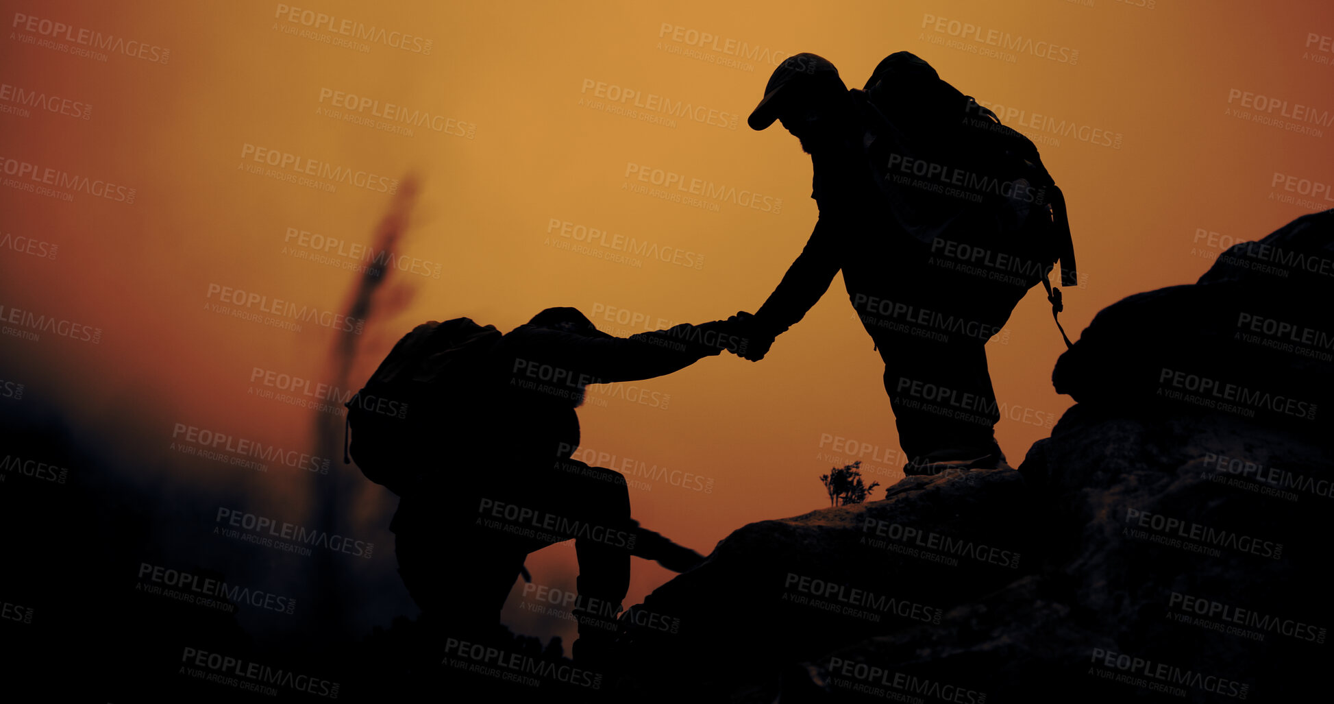 Buy stock photo Silhouette, hiking and people with help, travel and support for hobby, adventure or fitness. Hiker, holding hands or friends with backpacking challenge, trekking journey or climbing cliff with sunset