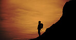 Outdoor, trekking and silhouette of man on mountain for adventure, reflection and vacation with view. Holiday, backpacking and person hiking at sunset, travel or thinking with space for sightseeing