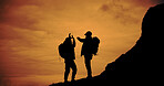 Sunset, silhouette and men with high five for hike on mountain for vacation, adventure or holiday. Nature, sky and shadow of friends with celebration for backpacking goal on weekend trip for trekking