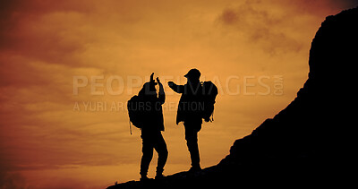 Buy stock photo Sunset, silhouette and men with high five for hike on mountain for vacation, adventure or holiday. Nature, sky and friends with celebration for backpacking goal on weekend trip for trekking.