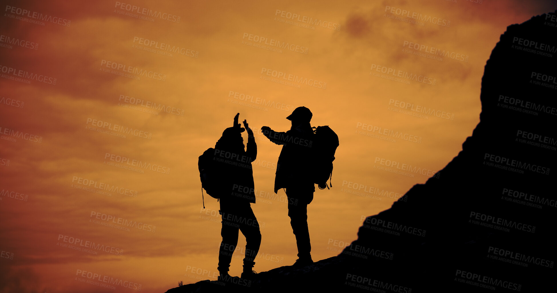 Buy stock photo Sunset, silhouette and men with high five for hike on mountain for vacation, adventure or holiday. Nature, sky and friends with celebration for backpacking goal on weekend trip for trekking.