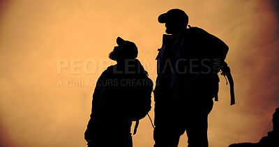 Buy stock photo Mountain, sunset and silhouette of men with hiking, travel and backpacking with view and below. Shadow, eco tourism and outdoor with evening, nature and fitness or exercise for wellness with friends