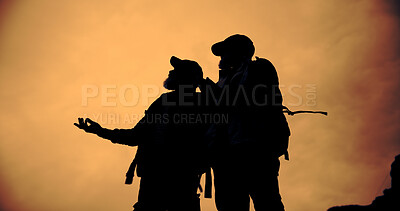 Buy stock photo Mountain, sunset and silhouette of friends with hiking, travel and backpacking with view and below. Shadow, eco tourism and outdoor with evening, nature and fitness or exercise for wellness with men