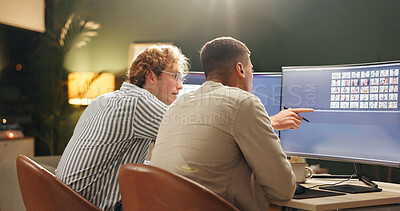 Buy stock photo Night, creative and people in office with computer, image review and selection for digital marketing. Late, team and point with desktop for photography chat, brainstorming or insight for advertising.