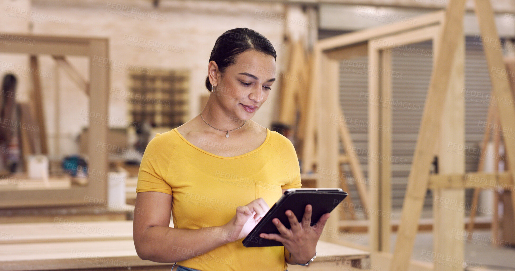 Buy stock photo Carpenter, tablet or woman in workshop, typing or online checklist for production process. Manufacturing, furniture industry or person in factory, tech or email for design idea, inventory or planning