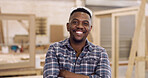 Portrait, carpenter and black man in warehouse, arms crossed and manufacturing project. Small business, entrepreneur and person in factory, smile and pride for furniture industry, tools and woodwork