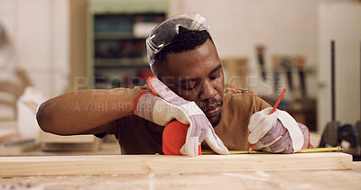 Buy stock photo Carpenter, writing and black man with tape measure in workshop, construction process and precision. Tools, carpentry and woodworker with plank for creative project, material preparation and craft