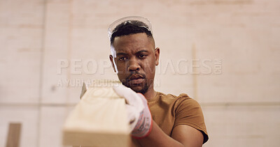 Buy stock photo Carpenter, man and inspection in factory with woodwork, remodeling project and furniture production. Black person, check timber or quality control with craftsmanship, carpentry or manufacturing plan.