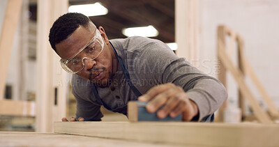 Buy stock photo Carpentry, sanding and black man with measuring wood in workshop for furniture development with precision. Tools, timber and African male carpenter with plank for woodworking or handicraft project.