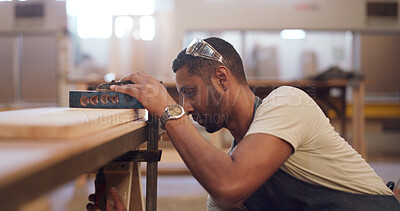 Buy stock photo Carpenter, workshop and man with clamp on wood for furniture production, manufacturing or design. Woodwork, carpentry and person with tools on plank for joinery, craft and industrial equipment