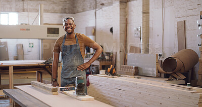 Buy stock photo Portrait, carpenter or man in workshop with woodwork, electric tools or furniture manufacturing project. Confident, black person and smile in factory with carpentry gear, equipment and craftsmanship.