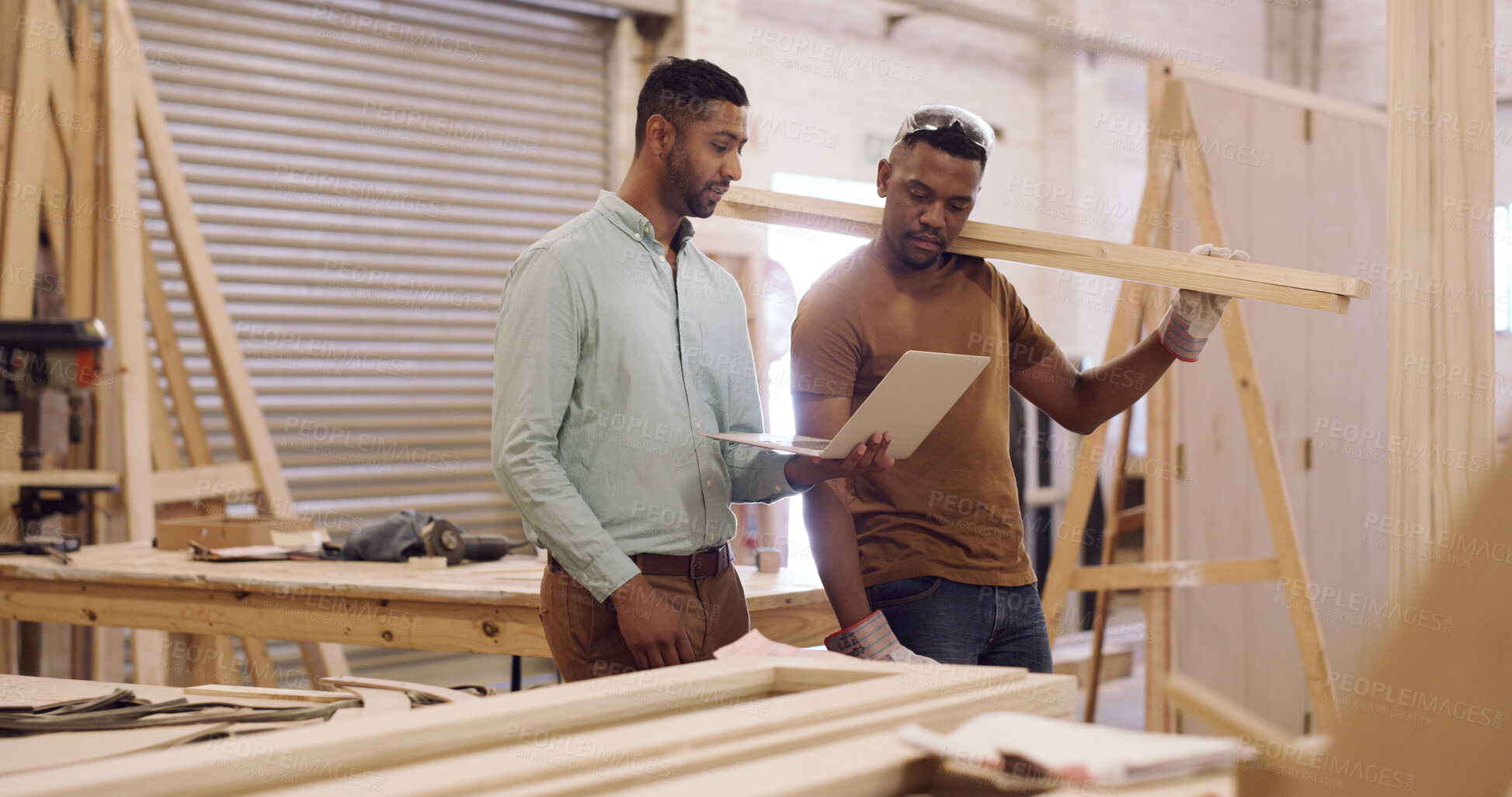 Buy stock photo Carpenter, tablet or men in workshop, reading or conversation for project deadline. Inventory order, furniture industry or people in factory, tech or email for material, talking or production process