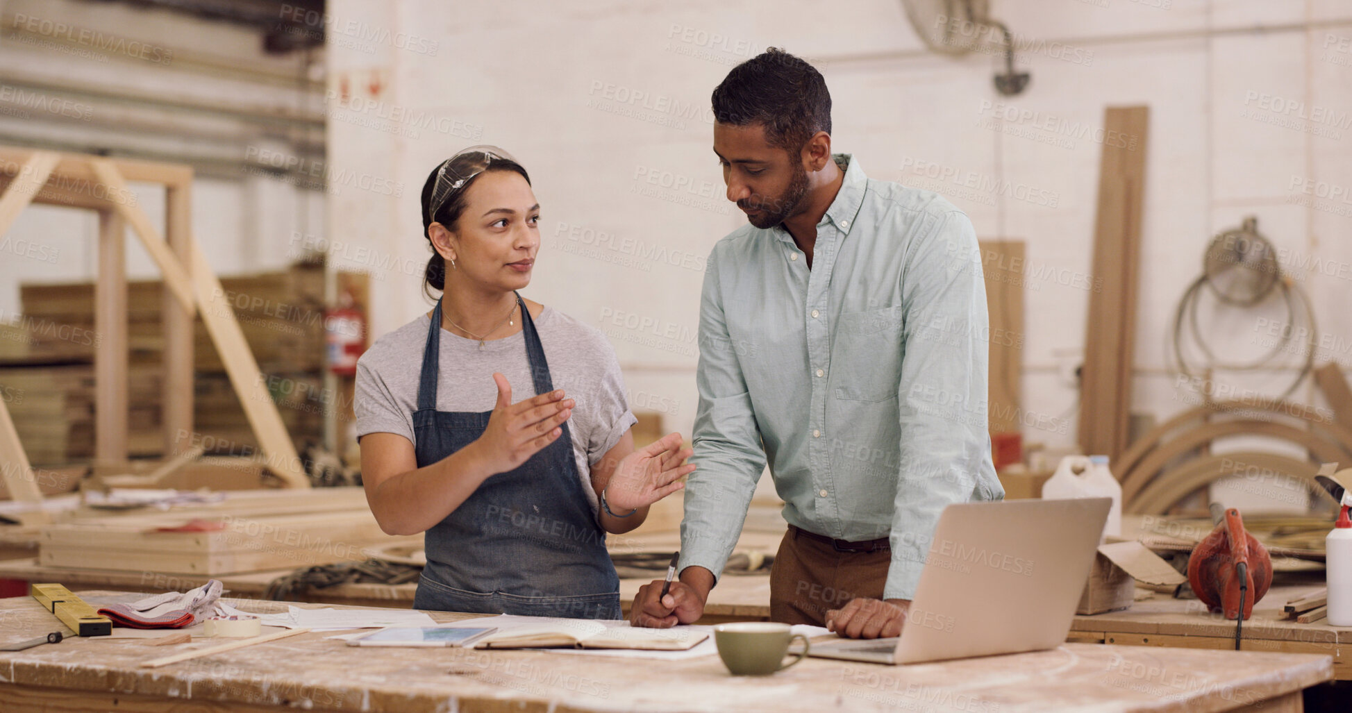 Buy stock photo Carpentry, laptop and people in workshop, conversation for production process and manufacturing. Furniture industry, man or woman in factory, pc or discussion for project schedule or timber inventory