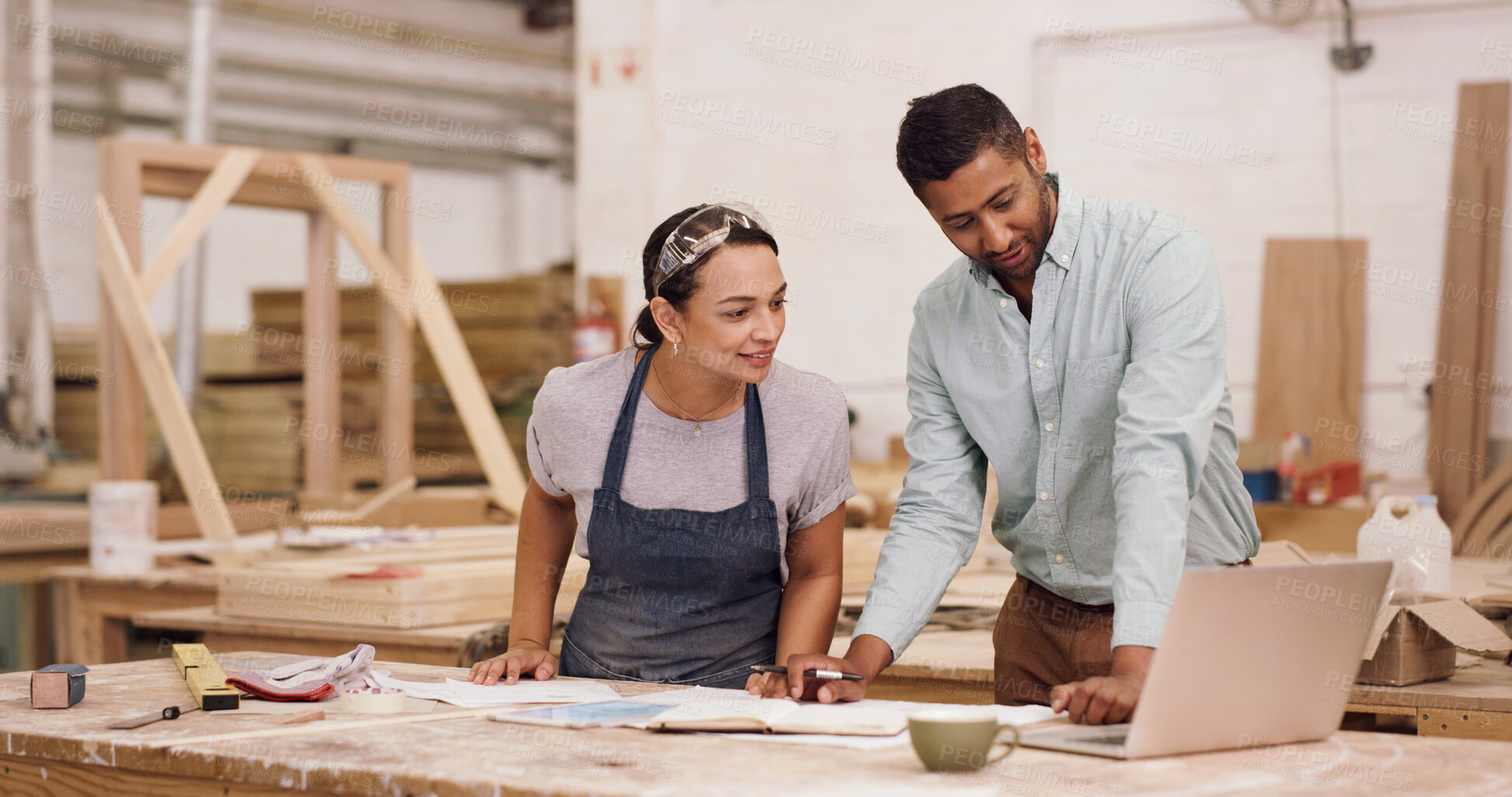 Buy stock photo Carpentry, laptop and people in factory, conversation for production process and inventory checklist. Furniture industry, man and woman in workshop, pc and discussion for renovation project and email