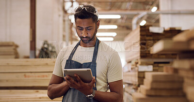 Buy stock photo Carpenter, tablet and man in workshop, reading and planning for production process. Inventory order, furniture industry or person in factory, tech or email for design project, typing or manufacturing