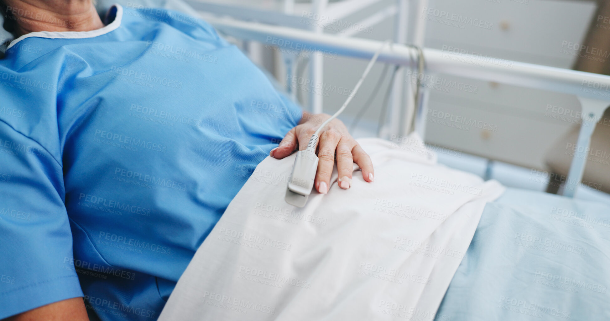 Buy stock photo Hand, hospital bed and woman with oximeter to monitor pulse, healthcare and measure blood levels. Patient, medical service and person in clinic, track oxygen and wellness with rest for recovery