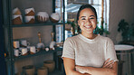 Portrait, woman and arms crossed at small business for pottery with career pride, about us and ceramic. Smile, female person and entrepreneur with ambition, experience and production for sculpture