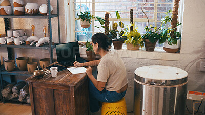 Buy stock photo Entrepreneur, writing and woman in ceramic store, small business planning and track inventory sales. Shop admin, to do list and person with notebook to monitor expenses, pottery startup and budget