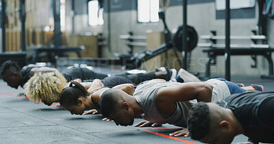 Buy stock photo Exercise, push up and row with people in gym together for class, course or training routine. Balance, strong and fitness with athlete group on floor in health club for challenge, wellness or workout