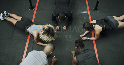 Buy stock photo Fitness, group and plank exercise at gym for core strength, endurance challenge and health class. Above, people and instructor with abdominal workout to improve posture and balance at wellness club
