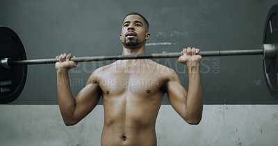 Buy stock photo Fitness, black man and exercise with barbell in gym, workout and strength training for muscle growth. Bodybuilder, shirtless person and weightlifting for power, wellness and overhead press in club