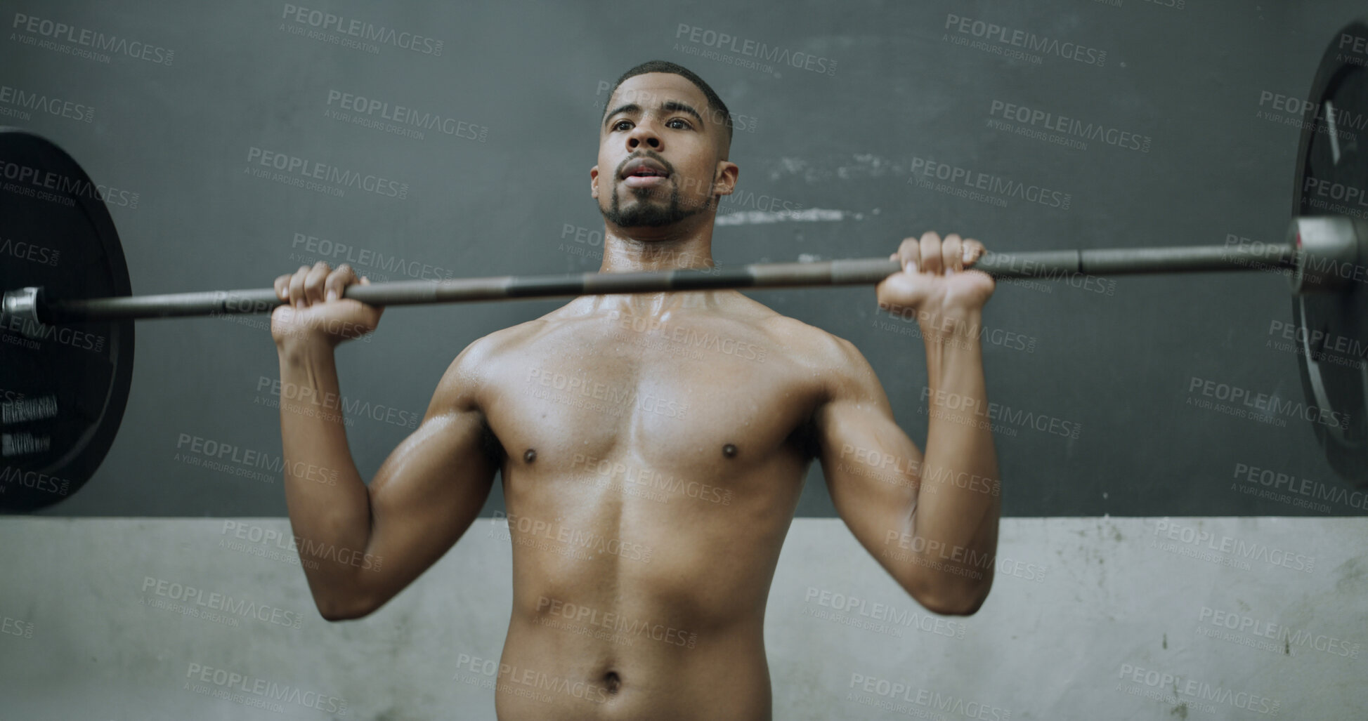 Buy stock photo Fitness, black man and exercise with barbell in gym, workout and strength training for muscle growth. Bodybuilder, shirtless person and weightlifting for power, wellness and overhead press in club