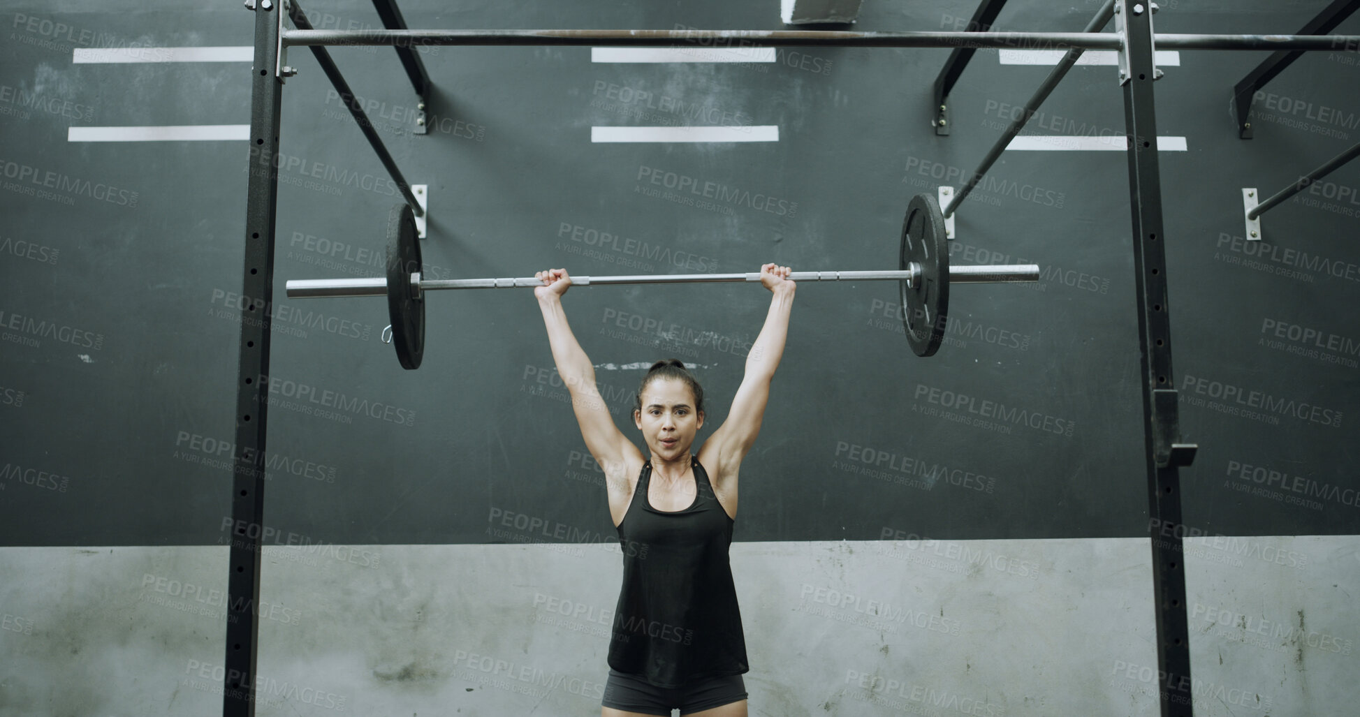 Buy stock photo Woman, portrait and weightlifting with barbell for muscle gain, training or indoor workout in gym. Active, female person or bodybuilder with strength or power for bodybuilding exercise in health club