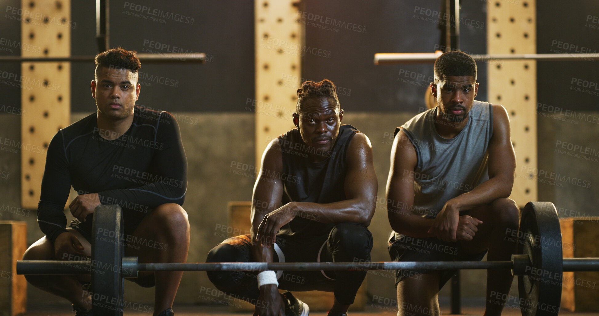 Buy stock photo Fitness, portrait and weight training with men in gym together for commitment or dedication. Barbell, equipment and exercise with group of serious friends in dark health club for challenge or workout