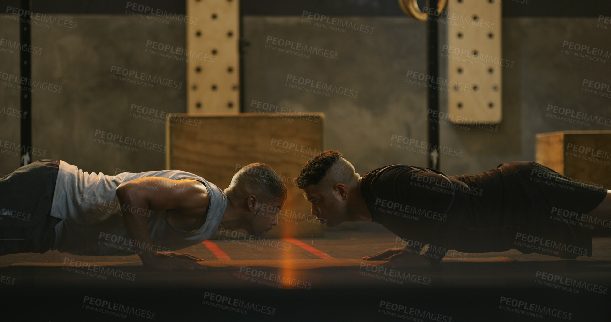 Buy stock photo Fitness, men and push up exercise at gym for core stability, strength training and muscle development. Teamwork, people and personal trainer with functional workout in dark health club for endurance