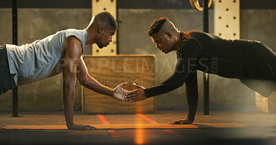 Buy stock photo Athlete, people and push up with handshake at gym for fitness, exercise and body balance. Men, plank and high five for motivation, strength training and workout with teamwork for endurance challenge