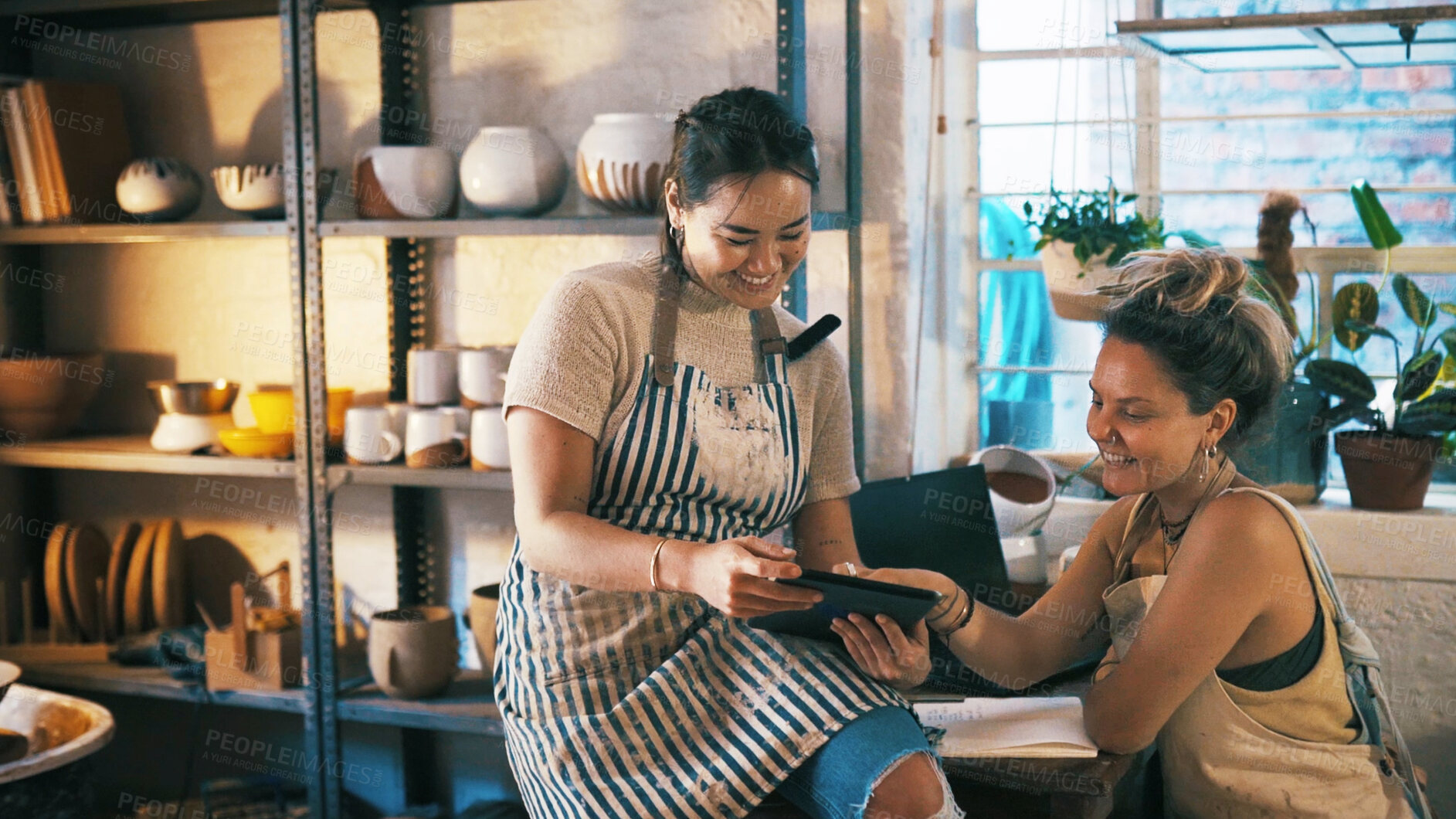 Buy stock photo Reading, ceramic or team in store with tablet, creative insight or customer review in clay shop. Partnership, women or owners with tech, consumer feedback or design planning in pottery business.