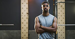 Crossed arms, serious and portrait of black man in gym for weightlifting, workout or training. Confident, fitness and African person with pride for bodybuilding, challenge or exercise in sport center