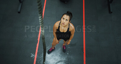 Buy stock photo Above, thinking and woman with rope at gym for fitness, climbing exercise and weightlifting. Thoughts, female person and reflection with equipment, strength training and ideas for endurance challenge