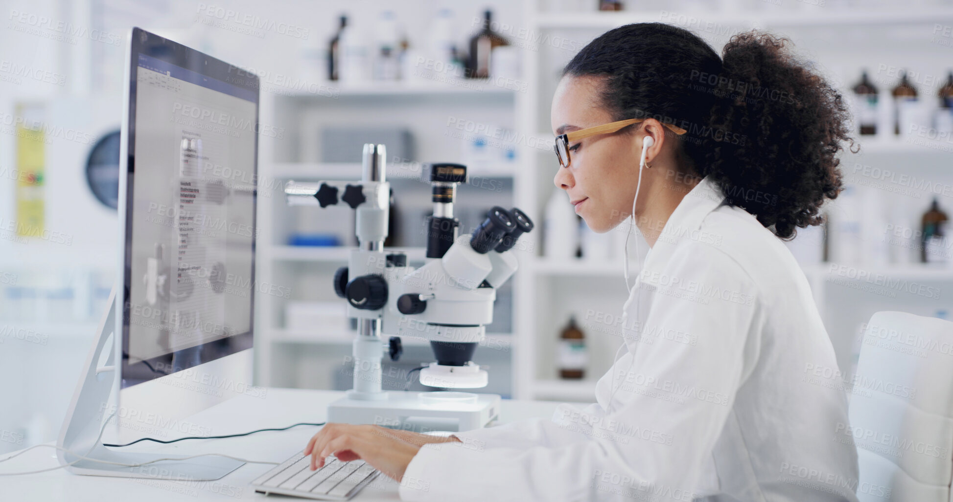 Buy stock photo Earphones, scientist and woman with computer in lab for research, drug development and typing. Music, science and person with tech for medical innovation, pharma study or listen to audio with screen